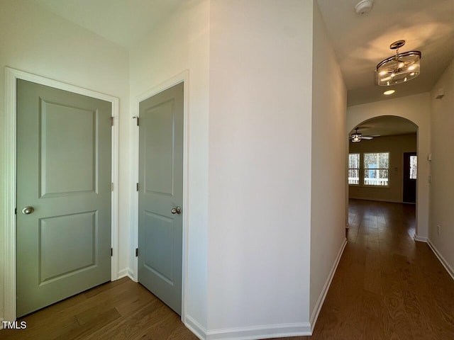 hallway featuring dark wood-type flooring