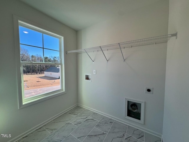 washroom with hookup for an electric dryer and hookup for a washing machine