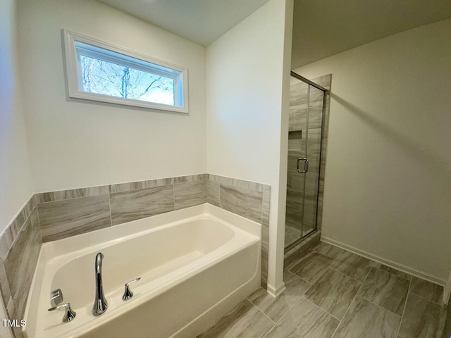 bathroom with separate shower and tub