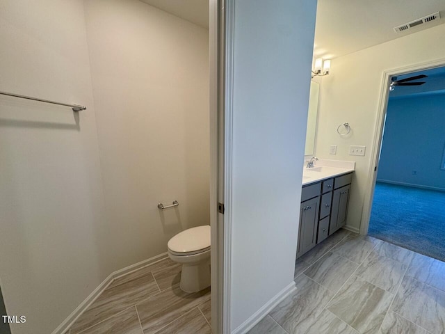 bathroom with vanity and toilet