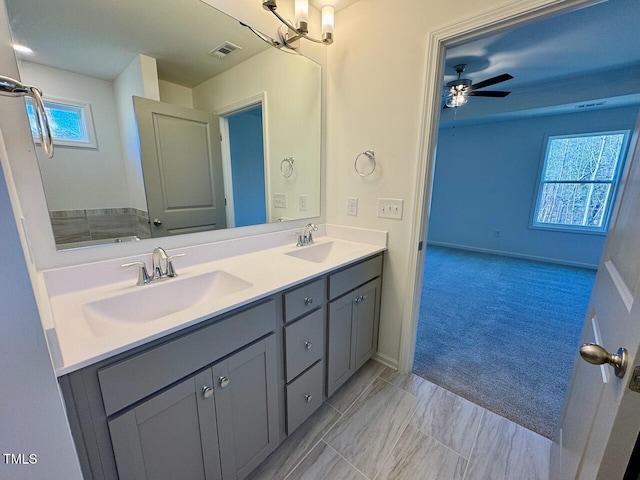 bathroom featuring vanity and ceiling fan