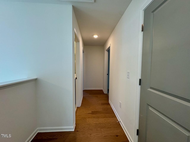 corridor with dark hardwood / wood-style floors