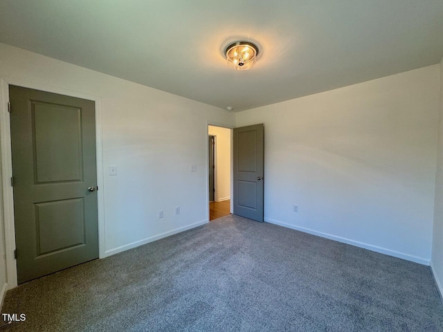 unfurnished room featuring carpet flooring