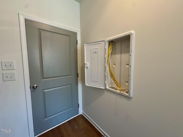 entryway featuring dark wood-style floors and baseboards