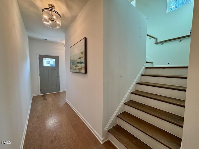 interior space with baseboards and wood finished floors