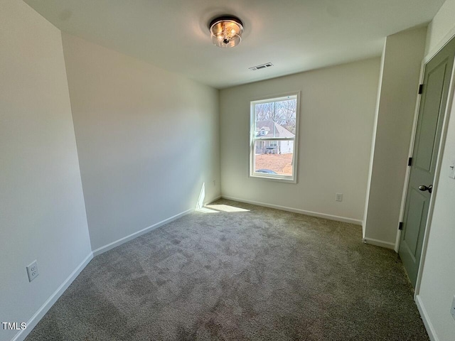 unfurnished bedroom with carpet floors, visible vents, and baseboards