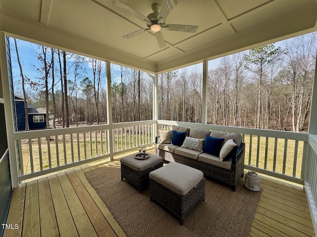 sunroom / solarium with a ceiling fan and a wealth of natural light