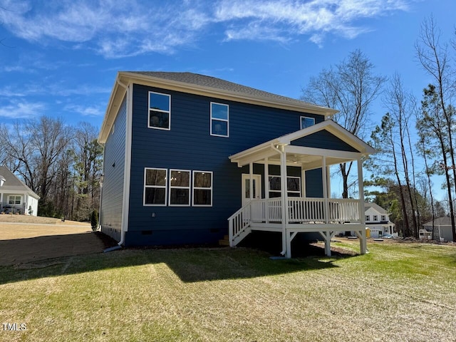 rear view of property with crawl space, a porch, and a yard