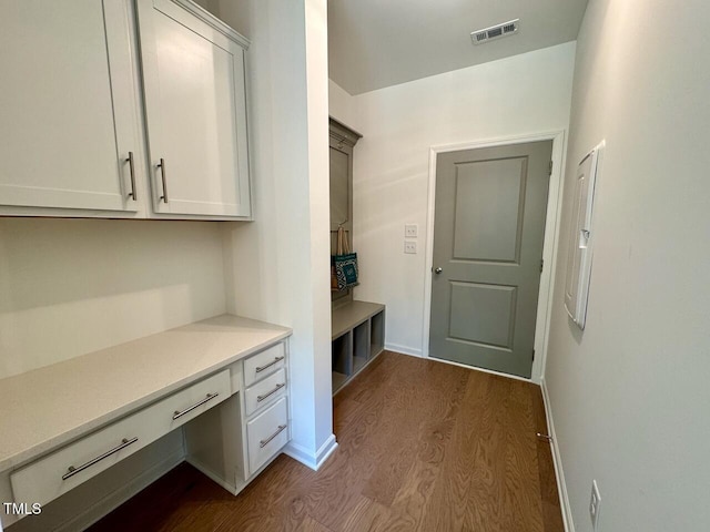196 Grand Griffon Way, Lillington, NC 27546 - mudroom with built in desk, dark wood-style flooring, and baseboards