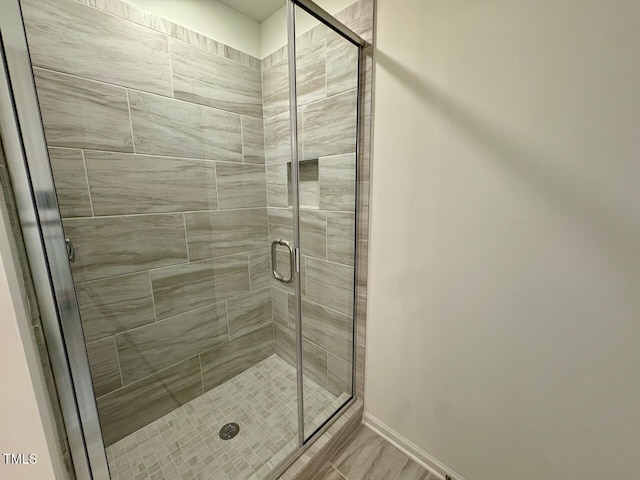 196 Grand Griffon Way, Lillington, NC 27546 - full bathroom with a shower stall and baseboards