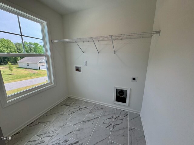 196 Grand Griffon Way, Lillington, NC 27546 - laundry area with washer hookup, baseboards, electric dryer hookup, and light marble finish flooring