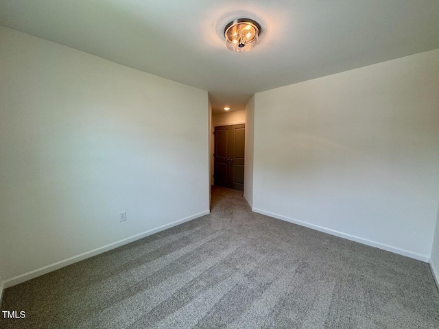 196 Grand Griffon Way, Lillington, NC 27546 - spare room featuring baseboards and carpet floors