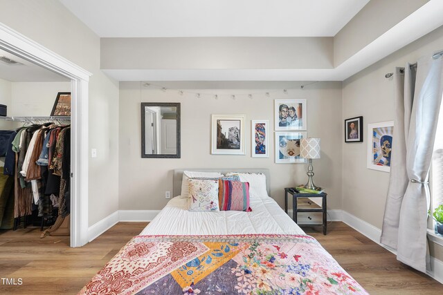 bedroom with a closet and light wood-type flooring