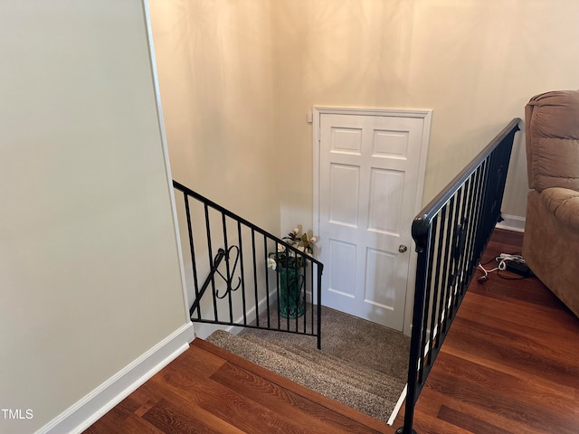 staircase featuring hardwood / wood-style flooring