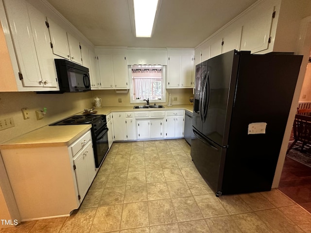 kitchen with sink, white cabinets, and black appliances