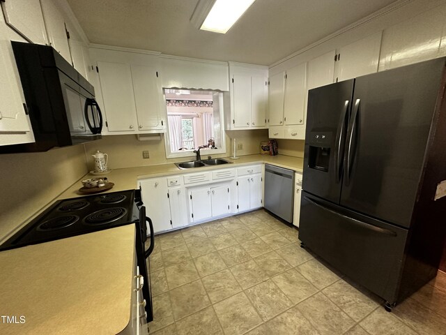 kitchen featuring white cabinetry, sink, and black appliances