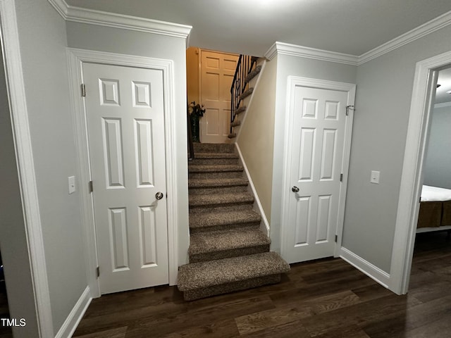 stairs featuring hardwood / wood-style flooring and ornamental molding