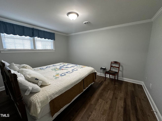 bedroom with crown molding and dark hardwood / wood-style floors