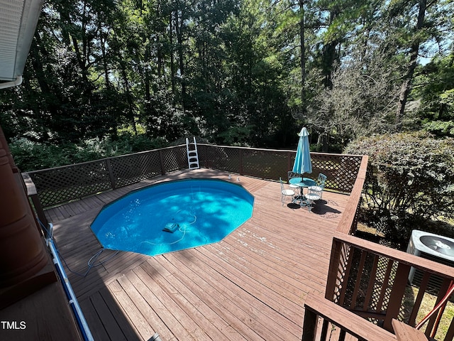 view of pool featuring a wooden deck