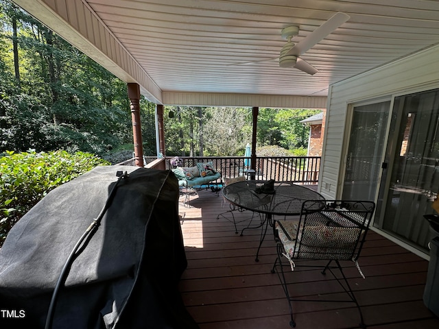 wooden deck featuring ceiling fan and an outdoor hangout area