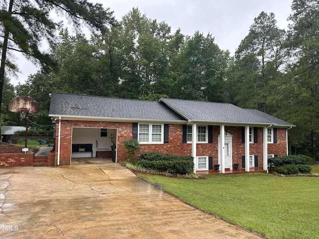 view of front of home featuring a garage and a front lawn