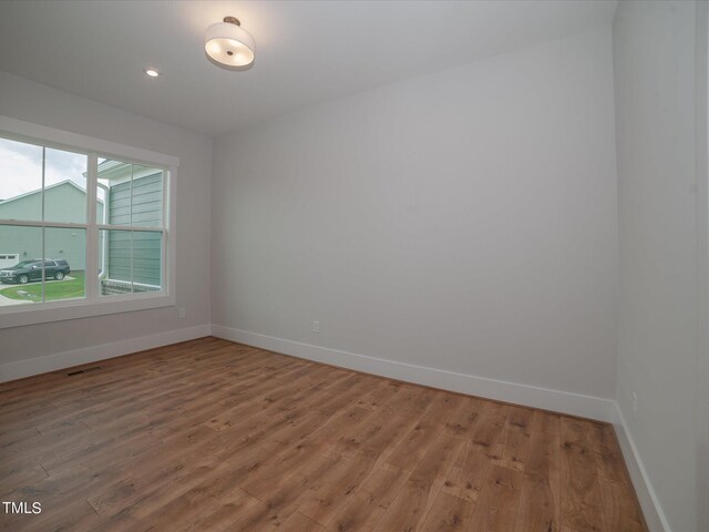 16 Autumn Breeze Ct, Angier, NC 27501 - unfurnished room featuring light wood-type flooring, baseboards, and recessed lighting