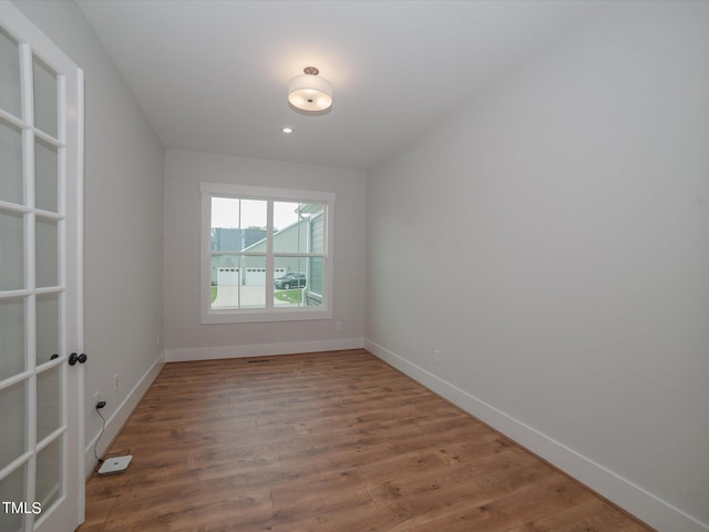 16 Autumn Breeze Ct, Angier, NC 27501 - spare room featuring baseboards and wood finished floors
