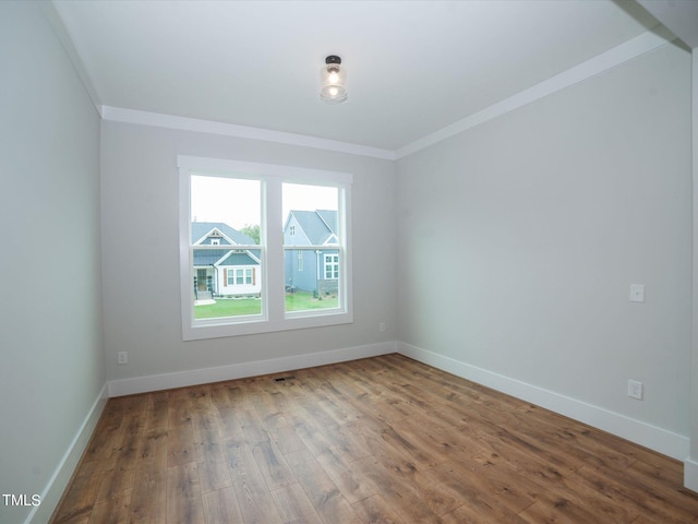 16 Autumn Breeze Ct, Angier, NC 27501 - unfurnished room with ornamental molding, wood finished floors, and baseboards