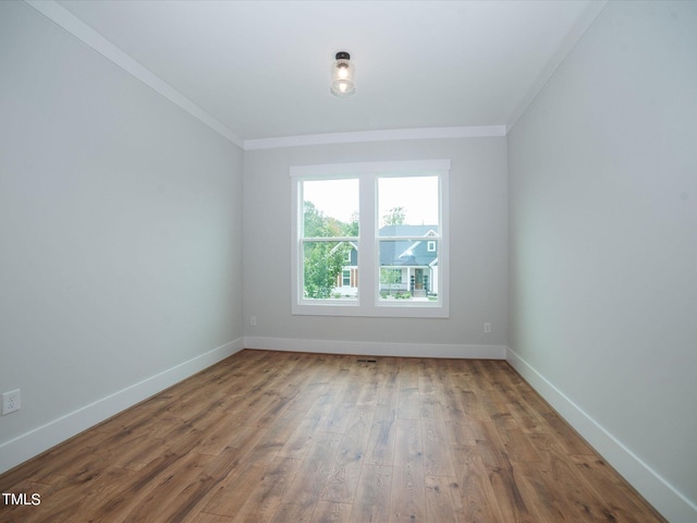 16 Autumn Breeze Ct, Angier, NC 27501 - spare room with ornamental molding, wood finished floors, and baseboards