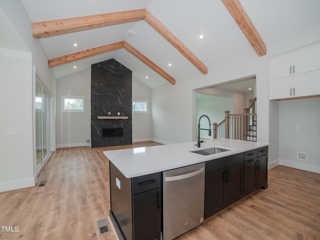 16 Autumn Breeze Ct, Angier, NC 27501 - kitchen with dishwasher, a sink, beam ceiling, light countertops, and white cabinetry