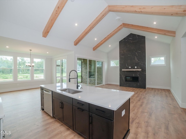 16 Autumn Breeze Ct, Angier, NC 27501 - kitchen with a sink, stainless steel dishwasher, open floor plan, high vaulted ceiling, and beamed ceiling