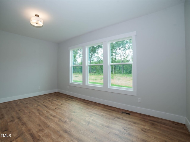 16 Autumn Breeze Ct, Angier, NC 27501 - spare room with baseboards and hardwood / wood-style floors