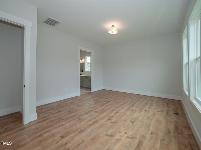 16 Autumn Breeze Ct, Angier, NC 27501 - spare room featuring light wood finished floors and baseboards