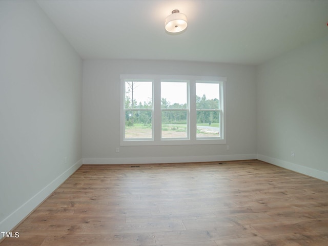16 Autumn Breeze Ct, Angier, NC 27501 - spare room featuring wood finished floors and baseboards
