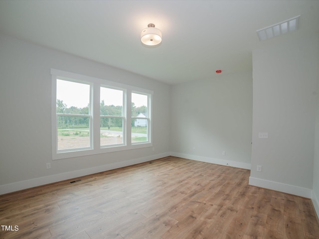 16 Autumn Breeze Ct, Angier, NC 27501 - spare room with baseboards and light wood finished floors