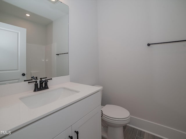 16 Autumn Breeze Ct, Angier, NC 27501 - bathroom featuring vanity, toilet, recessed lighting, and wood finished floors