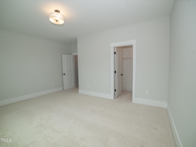 16 Autumn Breeze Ct, Angier, NC 27501 - unfurnished bedroom featuring carpet, a spacious closet, baseboards, and a closet