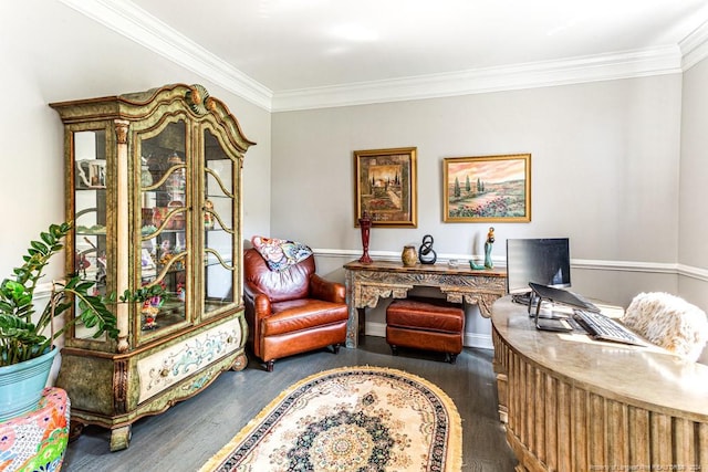 sitting room with dark wood-type flooring and ornamental molding