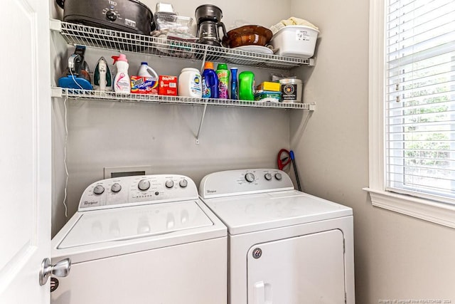 washroom featuring washer and clothes dryer