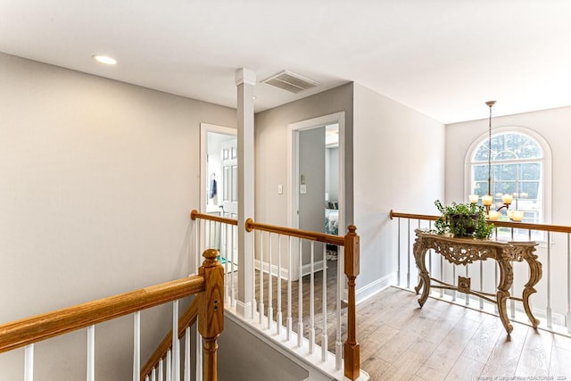 hall with light hardwood / wood-style flooring