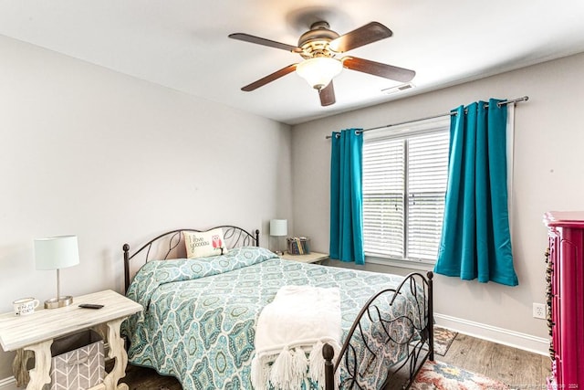 bedroom with hardwood / wood-style flooring and ceiling fan