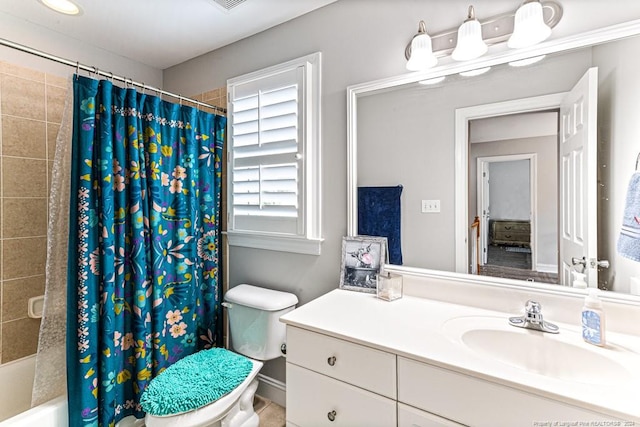 full bathroom featuring vanity, shower / tub combo, and toilet