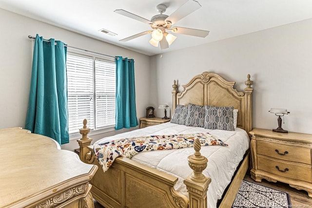 bedroom with hardwood / wood-style floors and ceiling fan