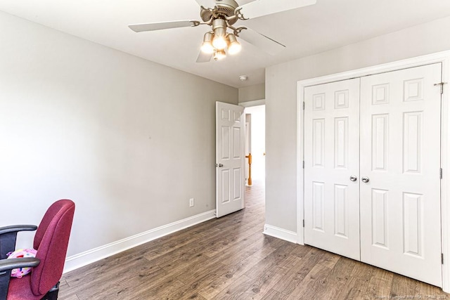 office area featuring dark hardwood / wood-style floors and ceiling fan