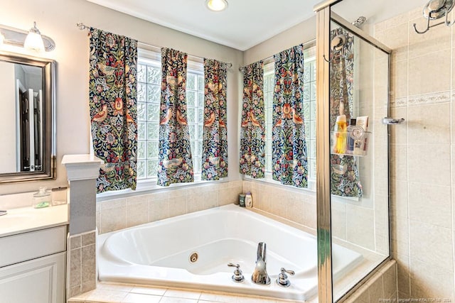 bathroom with vanity and separate shower and tub