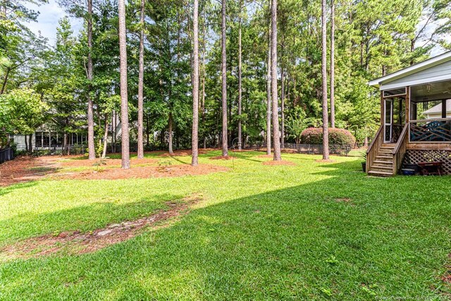 view of yard featuring a sunroom