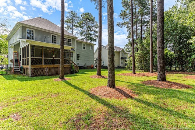 view of yard featuring a sunroom