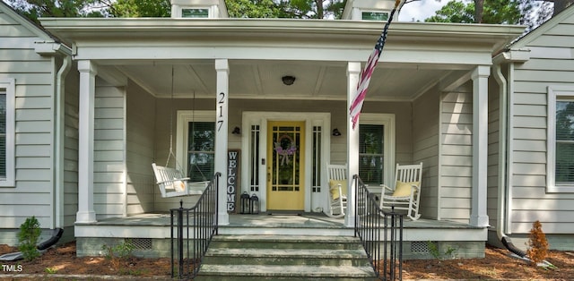 entrance to property with a porch