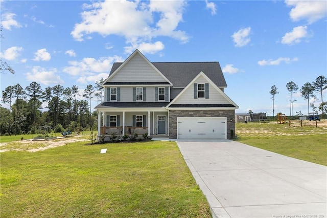 craftsman inspired home featuring a garage, a front yard, and a porch