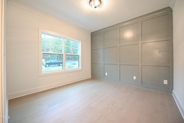 unfurnished room with light hardwood / wood-style floors